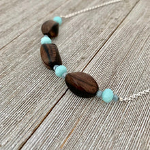 Load image into Gallery viewer, Tiger Ebony Necklace with Light Turquoise and Grey Crystals on a Silver Plated Chain