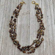 Load image into Gallery viewer, Three Strand Layered Necklace with Smoky Quartz, Bronzite, Bronze Fresh Water Pearls, Faceted Glass, 24k Plated Spacers, and Toggle Clasp