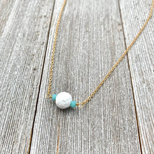 Load image into Gallery viewer, White Lava Diffuser Necklace, Turquoise Crystals, Matte Gold Chain