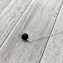Load image into Gallery viewer, Black Lava Diffuser Necklace, Misty Blue Crystals, Silver Chain