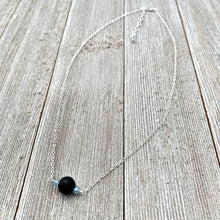 Load image into Gallery viewer, Black Lava Diffuser Necklace, Misty Blue Crystals, Silver Chain