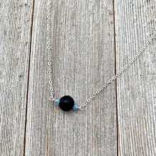 Load image into Gallery viewer, Black Lava Diffuser Necklace, Misty Blue Crystals, Silver Chain