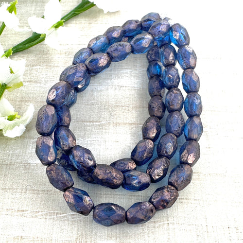 7x5mm Faceted Oval Blue with Etched and Bronze Finishes 