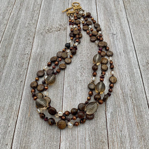 Three Strand Layered Necklace with Smoky Quartz, Bronzite, Bronze Fresh Water Pearls, Faceted Glass, 24k Plated Spacers, and Toggle Clasp
